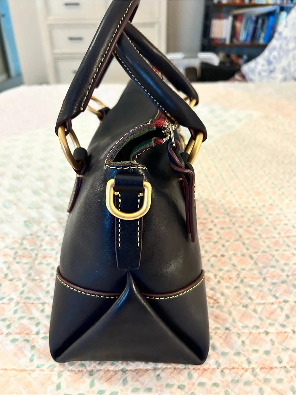 Dooney and Bourke Florentine Satchel 30 in the color Navy. EUC comes w/bag charm